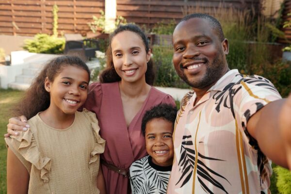 Smiling family taking selfie with white, healthy smiles